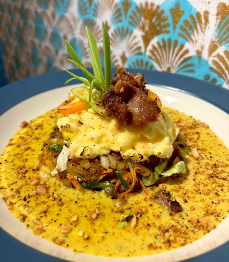 Flaming kottu at Vinya Garden by Seconds Colombo — hand-chopped roti tossed at the open flame, served on a wooden board